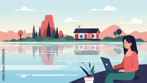 Woman working on laptop by serene lake with house and mountains