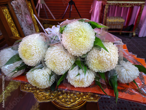 White Chrysanthemum Bouquet on Monk's Robe Offering for Thai Funeral