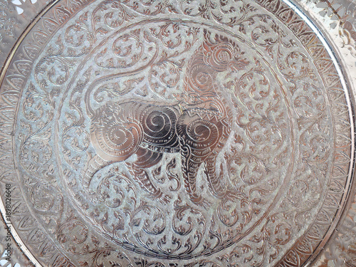 Intricate Silver Engraving of a Mythical Beast