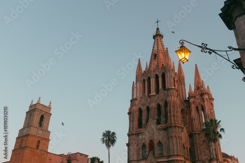 Bild auf Leinwand Parroquia de san miguel arcángel church at sunset