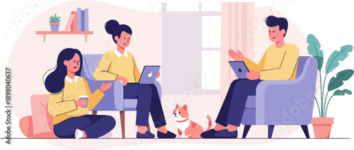 People working on laptops with a cat nearby in a cozy room