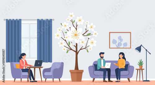 People working remotely on laptops in a cozy room with a blooming tree