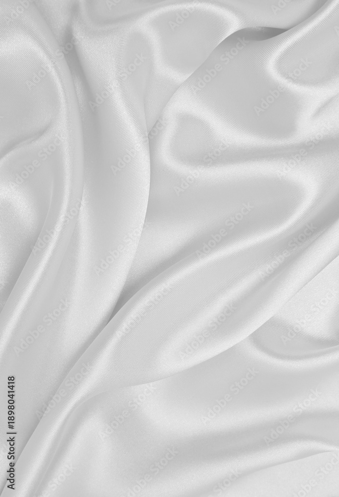 Fototapeta premium Smooth elegant white silk or satin luxury cloth texture as wedding background. Luxurious background design