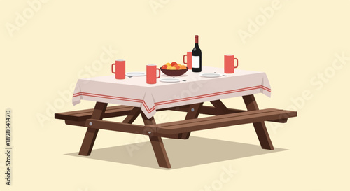 Picnic table set with red mugs, fruit bowl, and wine bottle