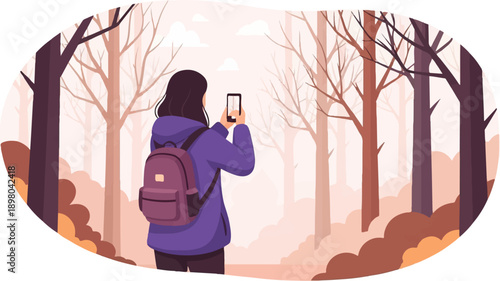 Person with backpack taking photo of misty autumn forest with bare trees