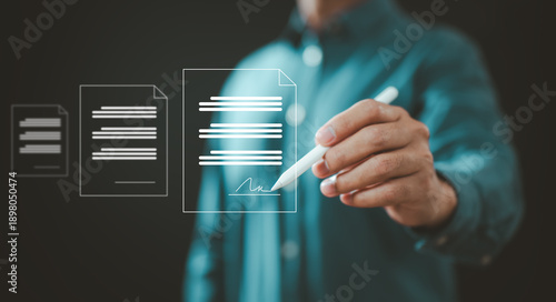 Businessman digitally signing electronic documents on transparent screen
