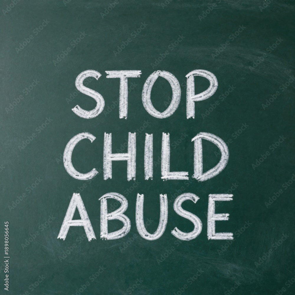 Obraz premium Stop child abuse message written on chalkboard in white chalk for awareness campaign