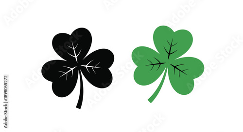 Two clover leaves one black and one green displayed side by side