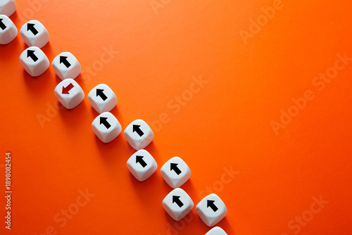 White dice with arrows showing contrasting direction