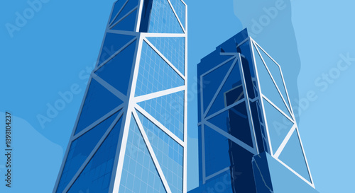 Modern geometric skyscrapers against a clear blue sky