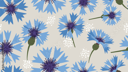 Seamless pattern of blue cornflowers and white dots on a neutral grey background for elegant floral textile print design.