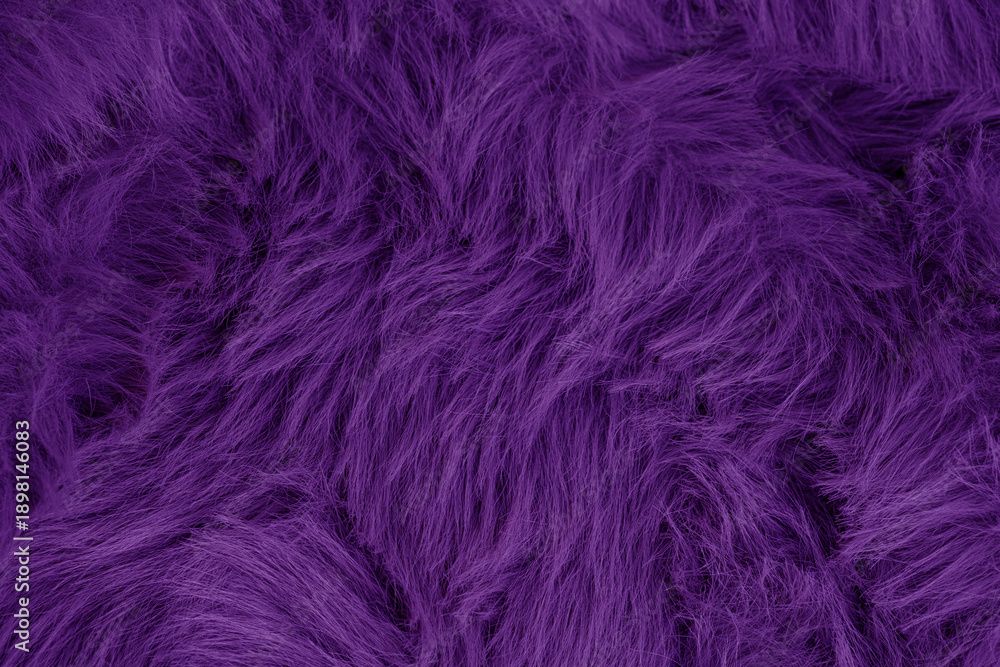 Obraz premium Close up view of luxurious deep purple shaggy faux fur textile fabric material plush soft background