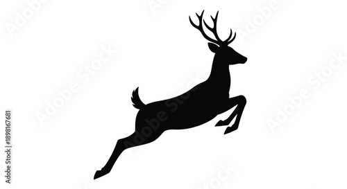 A leaping deer in stark contrast a dramatic black silhouette