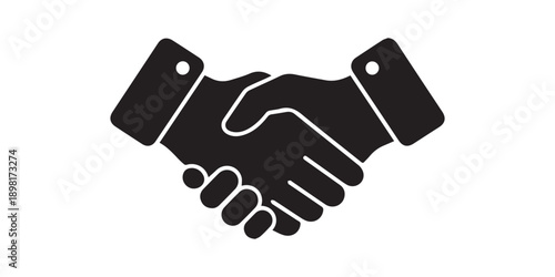 Two business professionals shaking hands in a formal agreement