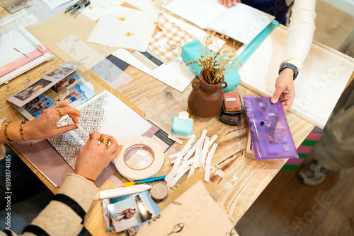 Fotografi Crafting handmade album during scrapbooking workshop