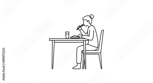 Woman eating at a table with a glass of water.