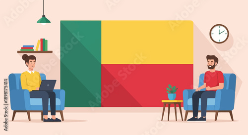 Two people in armchairs in front of a large flag; one on laptop