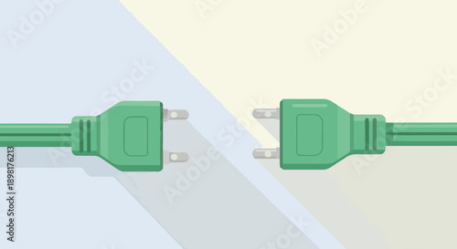 Two green electrical plugs are on a light background with shadow
