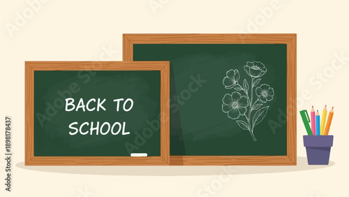 Two chalkboards with "Back to School" text and a flower drawing