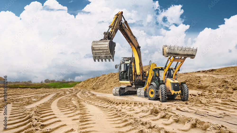 Εκτύπωση καμβά Heavy machinery leaves deep tracks in the sandy ground as loaders and excavators