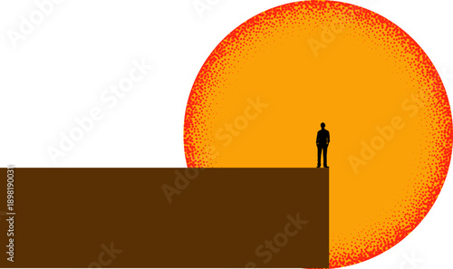 Silhouette of a man standing on the edge of a cliff looking at a vibrant sunset