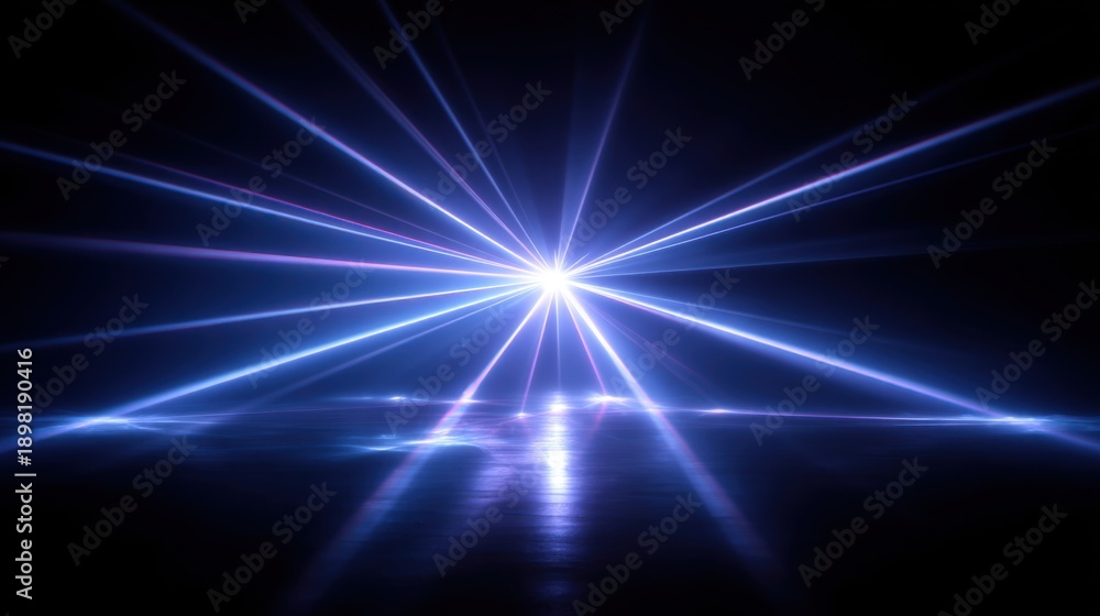 Fototapeta premium Blue light burst on reflective surface in dark background.