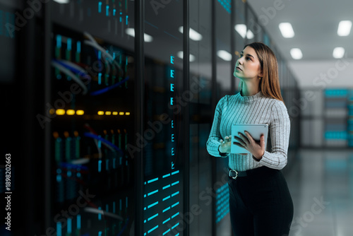 3D woman inspecting data server holding tablet device