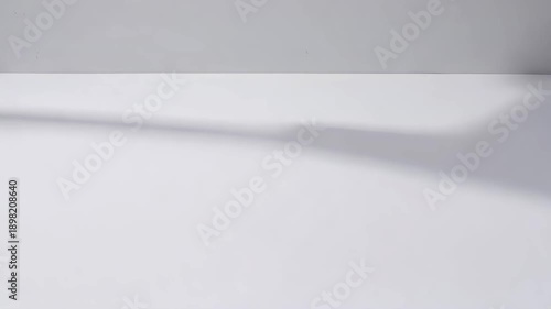 Abstract shadow on white surface with minimalist background  