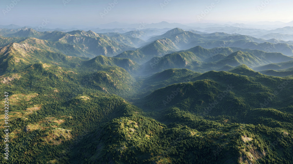 Fototapeta premium A breathtaking aerial view of lush green mountains stretching as far as the eye can see