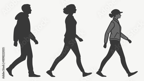 Silhouettes of three people walking in a row