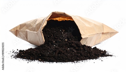 Bag of potting soil spilling onto a white surface.