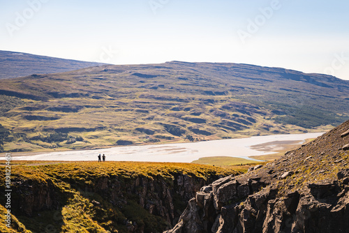 people on mountain trail in iceland