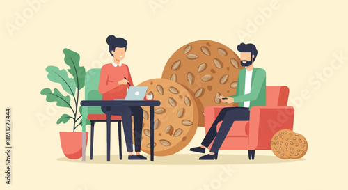 Two people interacting with technology and large cookies in a room