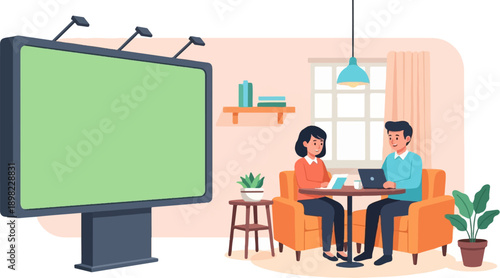 Two people work on laptops near a large outdoor billboard