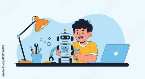 Young boy at his desk with a laptop happily assembles a small robot for a fun and educational STEM robotics school project.