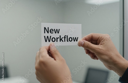 Hands Holding a New Workflow Sign, Demonstrating Change Management and Business Process Optimization