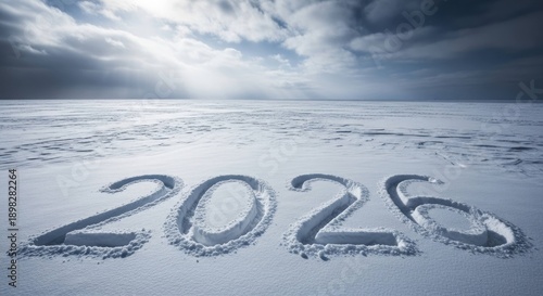 Wallpaper Mural 2026 carved in ice on a frozen landscape under a dramatic sky. Torontodigital.ca