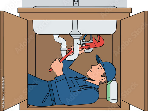 Plumber fixing sink pipes with adjustable wrench