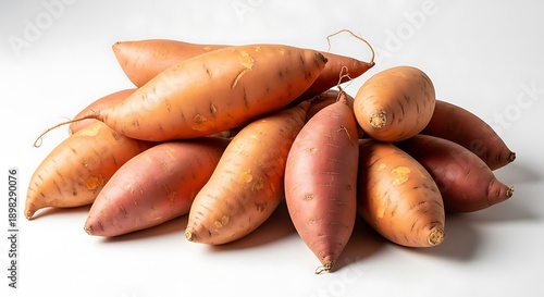 Pile of Fresh Sweet Potatoes on White Background