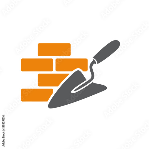 Trowel and orange bricks on white background for construction concept