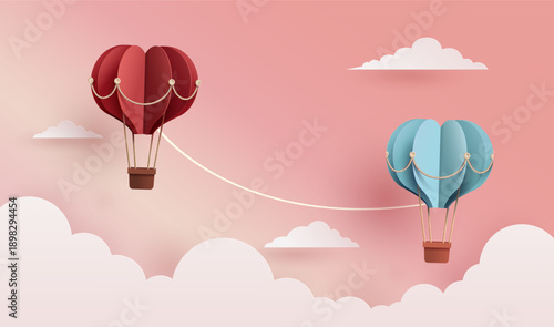 Paper art style vector illustration of two heart-shaped hot air balloons (red and blue) connected by a rope flying over clouds, Valentine's day and couple concept