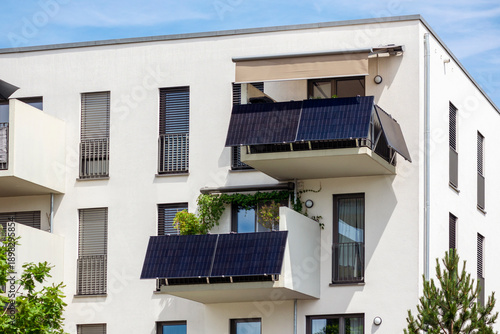 Modern Balcony with Solar Panels Station of Modern Facade Residential Apartment Building in Eco City. 