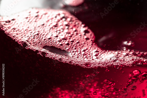 Red wine abstract splashing in glass.