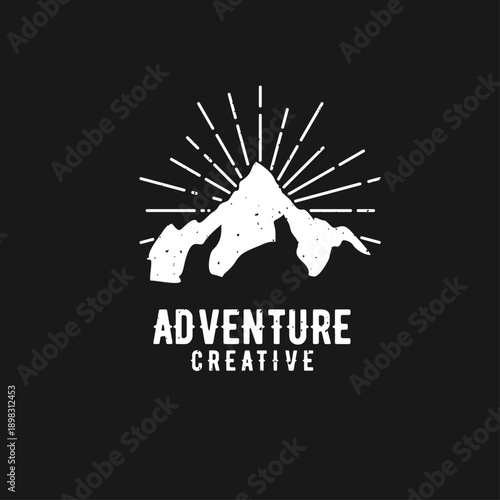 Vintage Adventure Creative Mountain Logo with Sun Rays on Black Background