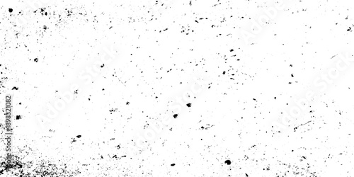 Black and white distressed grunge texture background with heavy grain, speckled noise and weathered surfaces.