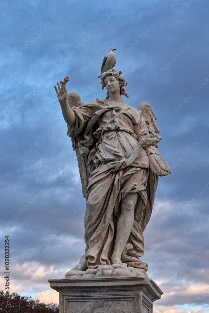 Fototapeta premium An angel, a seagull, and a perfect moment on the Ponte Sant'Angelo
