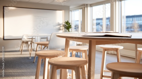 Bright modern interior atrium with white walls, glass windows, and cascading greenery along a railing. Glow!!!