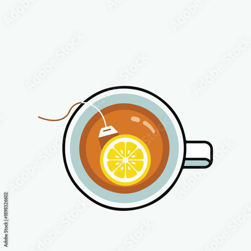 A top-down view of tea in a cup with lemon and teabag
