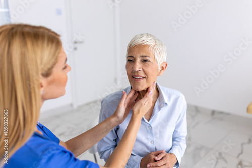 Tableau sur toile Female Doctor Performing Neck Palpation on Senior Patient, Medical Professional Examining Thyroid Glands of Elderly Woman, Healthcare Consultation and Diagnostic Screening