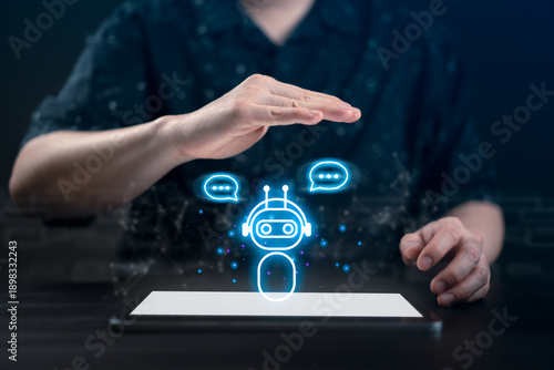 Businessman with hands over a glowing AI chatbot icon on a digital tablet. Concept of artificial intelligence assistant, automated customer service, smart communication, and future work technology.
